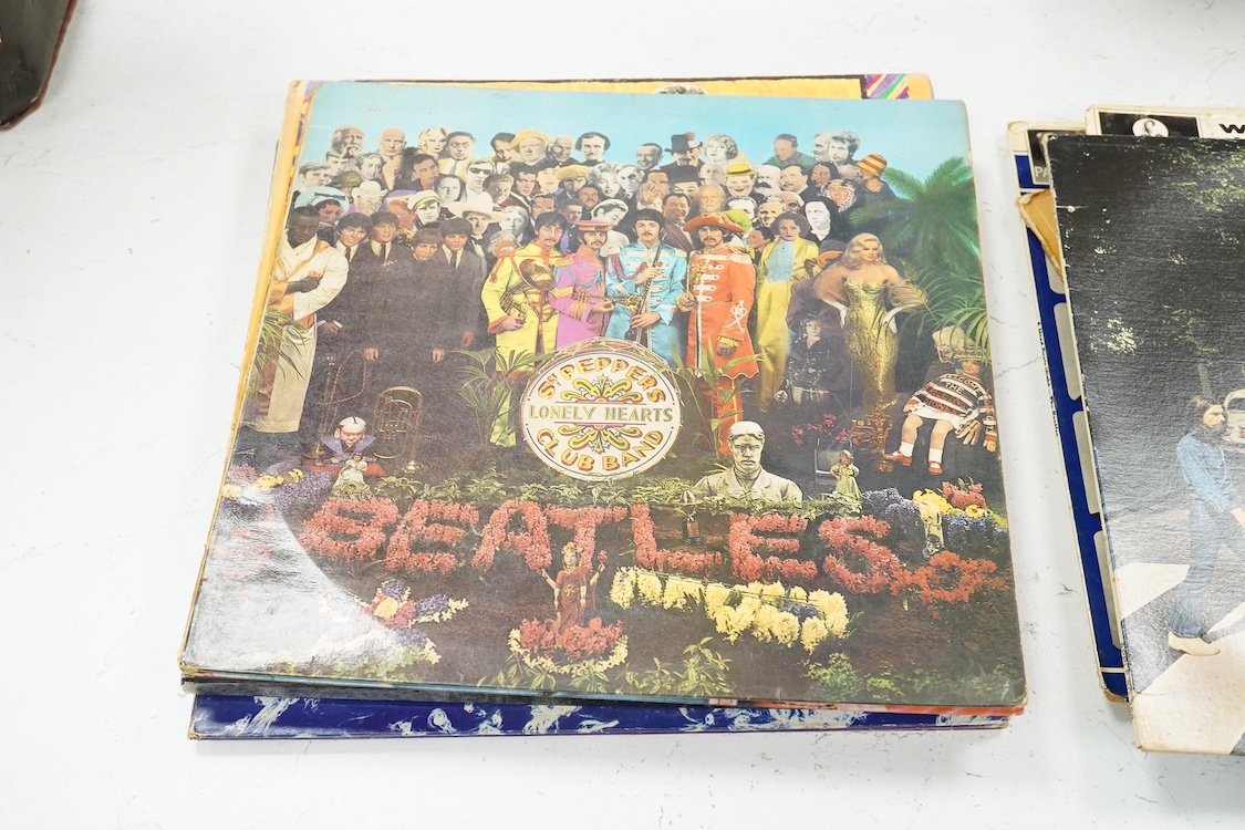 Eleven LP record albums including nine The Beatles and related albums; Beatles For Sale, Hey Jude, Yellow Submarine, All Things Must Pass, etc., together with the Rolling Stones; Their Satanic Majesties Request, and Pink